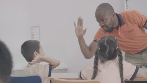 Active and caring teacher is teaching at kindergarten Stock Footage 134231989