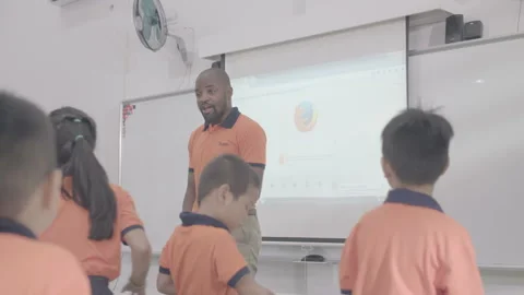 Active and caring teacher is teaching at kindergarten Stock Footage 134232049