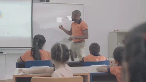 Active and caring teacher is teaching at kindergarten Stock Footage 134232090