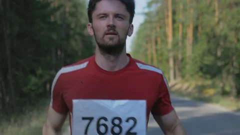 Active and determined man running in nature Stock Footage 74551768