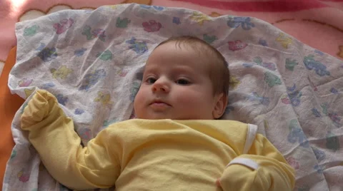 Active baby looking  and playing Vídeos de archivo 48145485