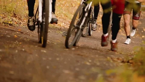 Active  bikers run with bicycle on the hill Stock-Footage 81880107
