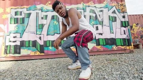 Active Black Guy Squatted On The Street. He Is Dancer. Young Guy With Stylish Stock Footage 142161508