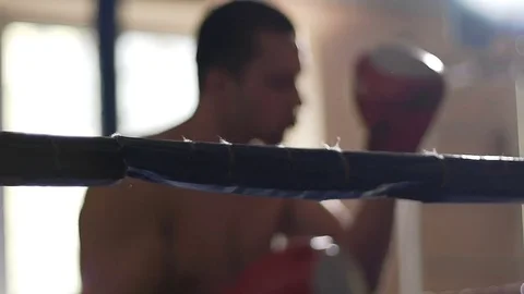 Active boxer shadow fighting in ring, training hard to defeat rival during match Video stock 74560329