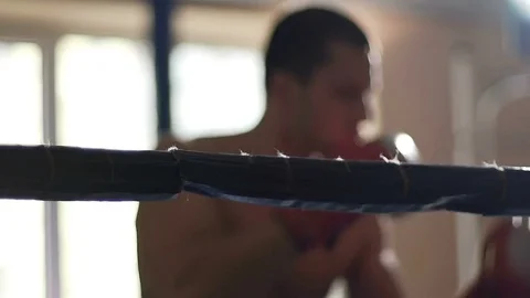 Active boxer shadow fighting in ring, training hard to defeat rival during match Video stock 74562074