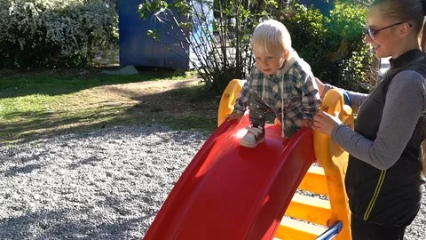 Active boy sliding down Stock Footage 74398283