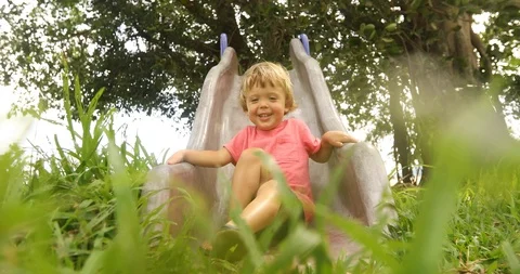 Active boy sliding down Stock-Footage 100060220
