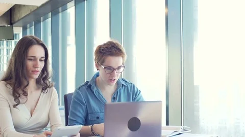 Active brainstorm of the creative team of young workers using laptop Видео 73517785