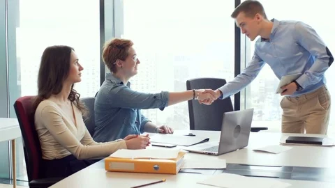 Active brainstorm of the creative team of young workers using laptop Stock Footage 73551963