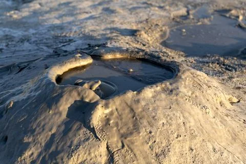 Active Bubbling Mud Pool Close-Up Stock Photos