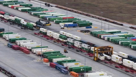 Active Cargo Handling Across Large Intermodal Logistics Facility Stock Footage 337716876