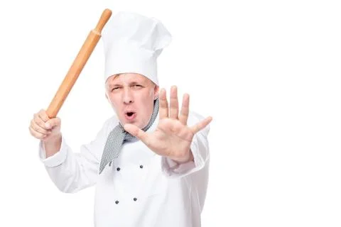 Active chef learns martial arts oriental with a rolling pin in hand Foto stock