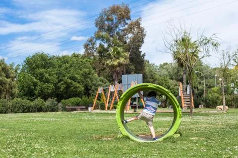 Active child playing in park Stock Photos