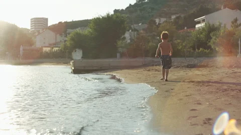 Active child running on the beach. Stock Footage 204853360