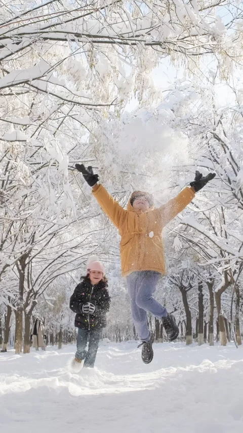 Active children having fun running playing with snow. Winter fun Stock Footage 297784714