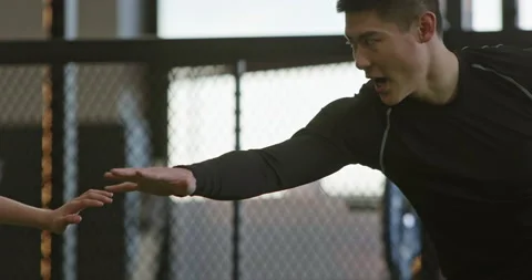 Active Chinese children having exercise class with their coach in gym,4K Stock Footage 156587028