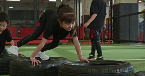 Active Chinese children having exercise class in gym,4K Stock Footage 156630190