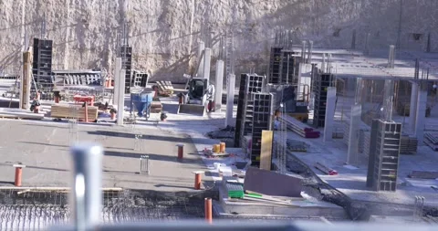 Active construction site with concrete columns and heavy equipment Stock Footage 336301141