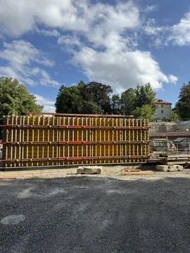 An Active Construction Site Featuring Stacked Formwork Surrounded by a Clear Stock Photos