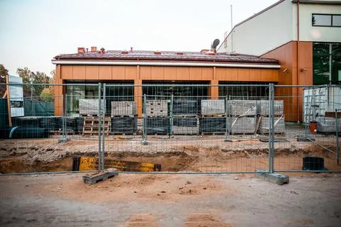 Active Construction Site with Modern Building and Wooden Facade Stock Photos