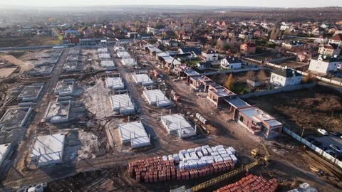 Active construction of a suburban cottage town view from a drone Video stock 174809173