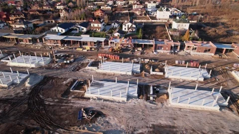 Active construction of a suburban cottage town view from a drone Video stock 174809693