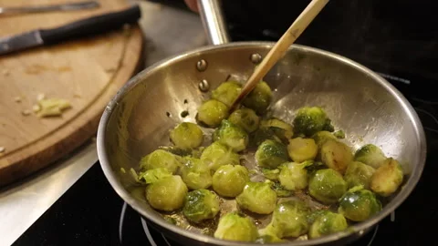 Active cooking, saute pan, vegetable cooking Stock Footage 311988091