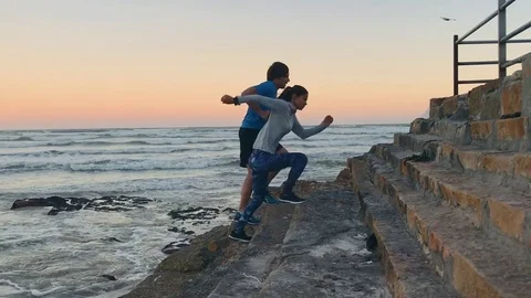 Active couple exercising at sunrise Video stock 76520905
