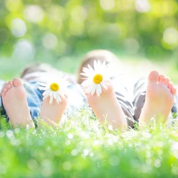 Active couple lying on grass Stock-Fotos