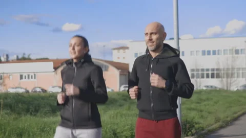 Active couple run in their leisure. Jogging concept, front view Stock Footage 150465801
