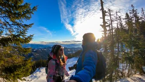 Active couple with scenic view of Lavant valley and Koralpe in Carinthia, S.. Stock Photos