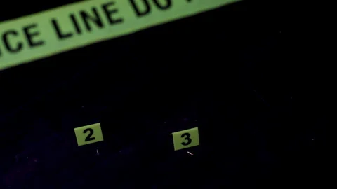 Active crime scene murder investigation police tape bullet evidence.t evidence Stock Footage 313967527