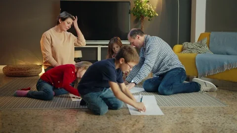 Active cute little smart boy in glasses constructing paper plane aviation with Stock Footage 125903785