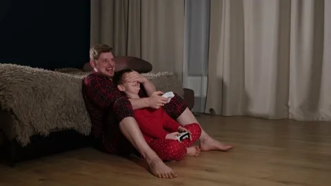 Active dad playing video game console with son 库存影片 169307799