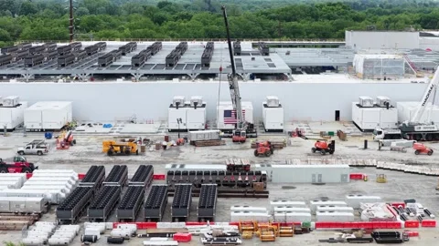 Active data center construction site with staged cooling units, heavy machinery Stock Footage 337529255