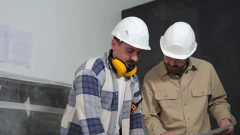 Active discussion of construction documentation by two builders or architects Stock Footage 234921094