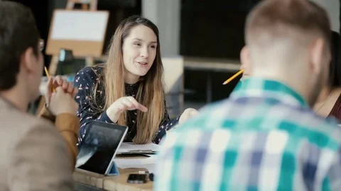 Active discussion of mixed race creative team. Business meeting in modern office Vidéo 75042128