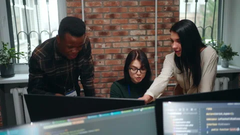 Active discussion of team of web developers of designers in office, multiethnic Stock Footage 233724806