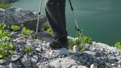 Active elderly man training Nordic walking. Natural background. Active leisure Stock Footage 166554597