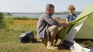 Active Family Setting Up Tent Stock Footage