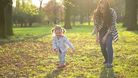 Active Female Child Having Fun During Sunny Spring Day. Funny Little Girl is Stock Footage 85436743