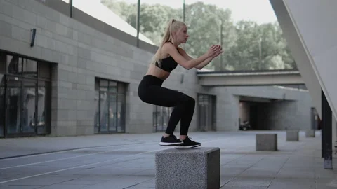 Active female jumping on block outdoors, preparing for crossfit competition Video stock 147020847