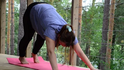 Active female  practicing meditation and yoga doing stretching exercise Stock Footage 301548200