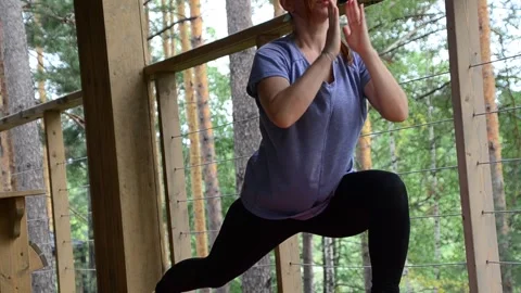 Active female  practicing meditation and yoga doing stretching exercise Stock Footage 301548207