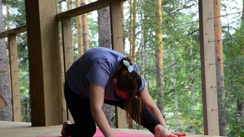 Active female  practicing meditation and yoga doing stretching exercise Stock Footage 301548209