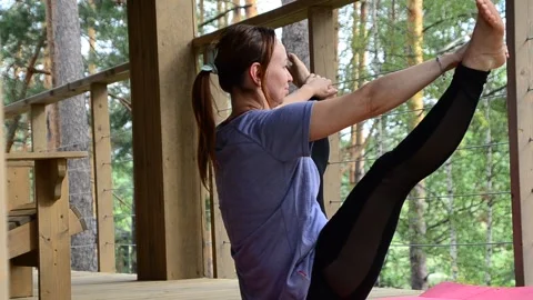 Active female  practicing meditation and yoga doing stretching exercise Stock Footage 301548550