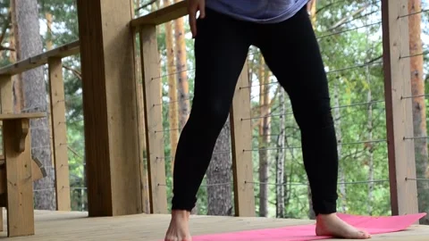 Active female  practicing meditation and yoga doing stretching exercise Stock Footage 301548571