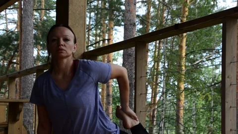 Active female  practicing meditation and yoga doing stretching exercise Stock Footage 301548585