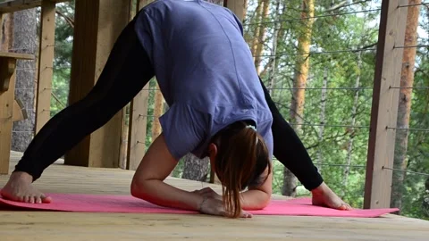 Active female  practicing meditation and yoga doing stretching exercise Stock Footage 301548593