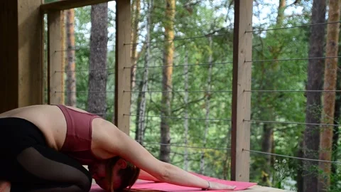 Active female  practicing meditation and yoga doing stretching exercise Stock Footage 301548615